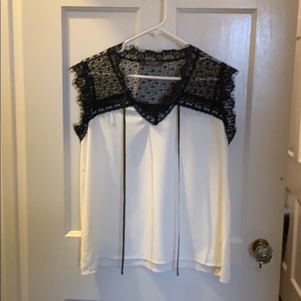 Stunning cream and black blouse. Size medium.